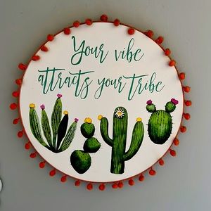 “Your vibe attracts your tribe” sign